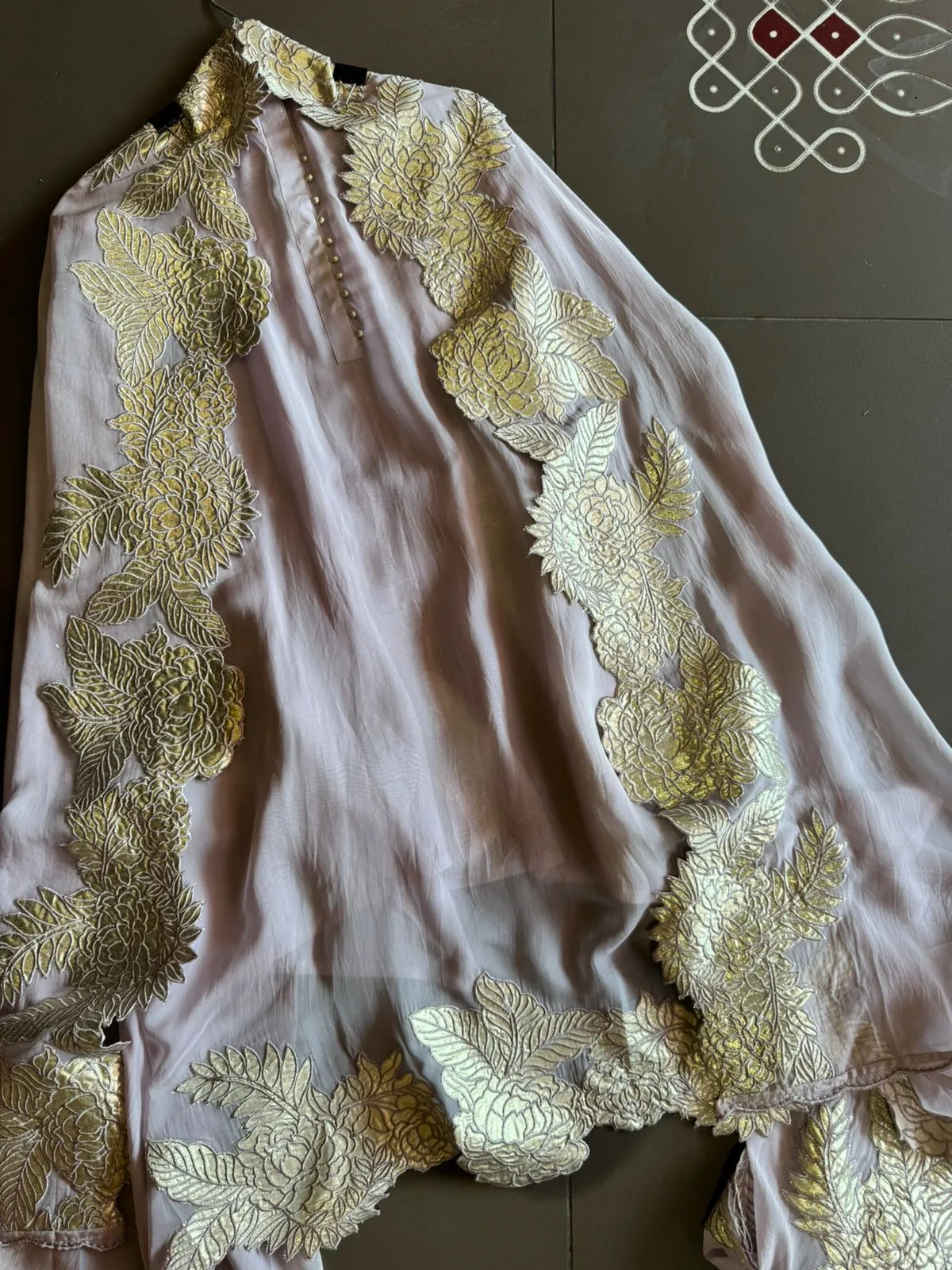 Super soft and Flowy organza with beautiful cushioning pattern on the shirt ghera and button detailings on the neckline